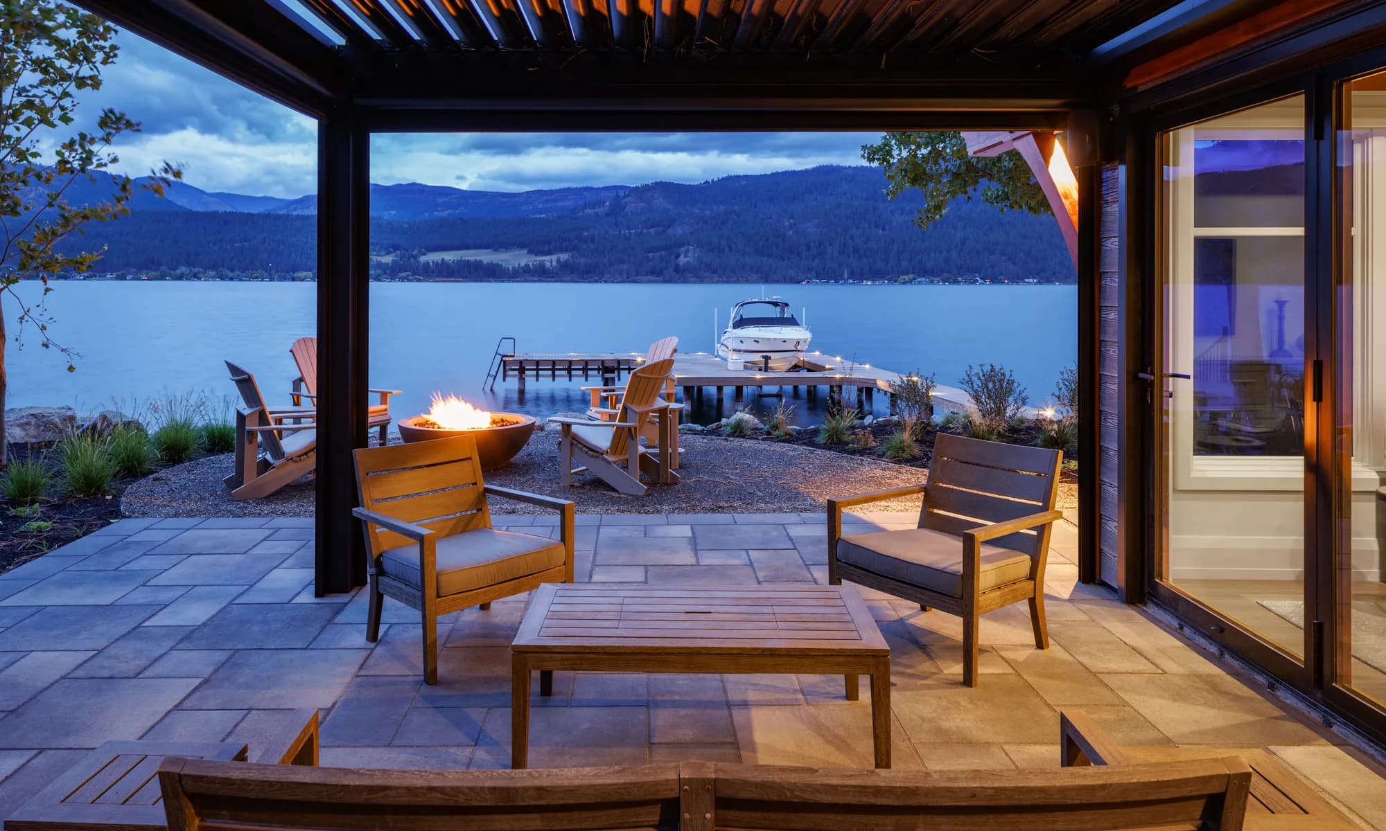 lake dront view and boat and chairs