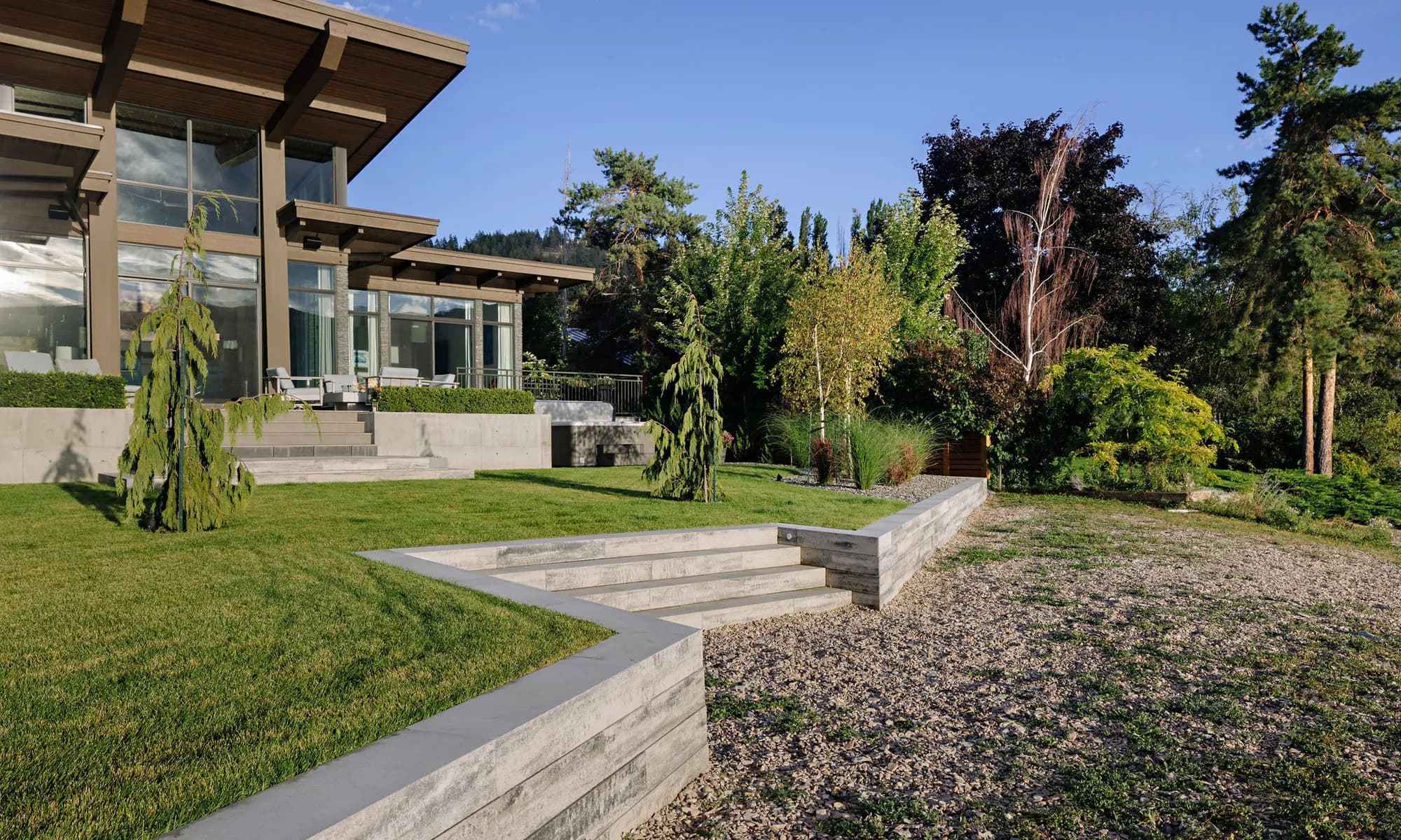 retaining wall and stairs and trees modern home