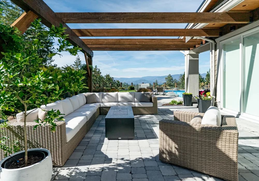 couches and progola and greenery and paver stones