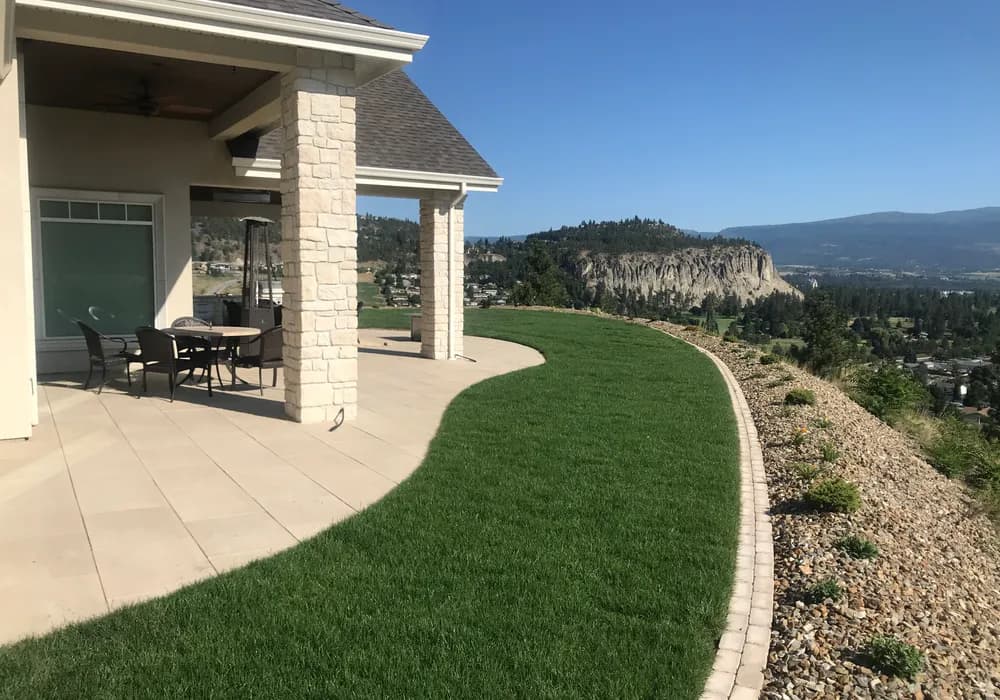 on top of a mountain modern home and yard