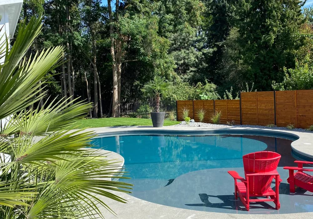pool and red chairs and stone ground