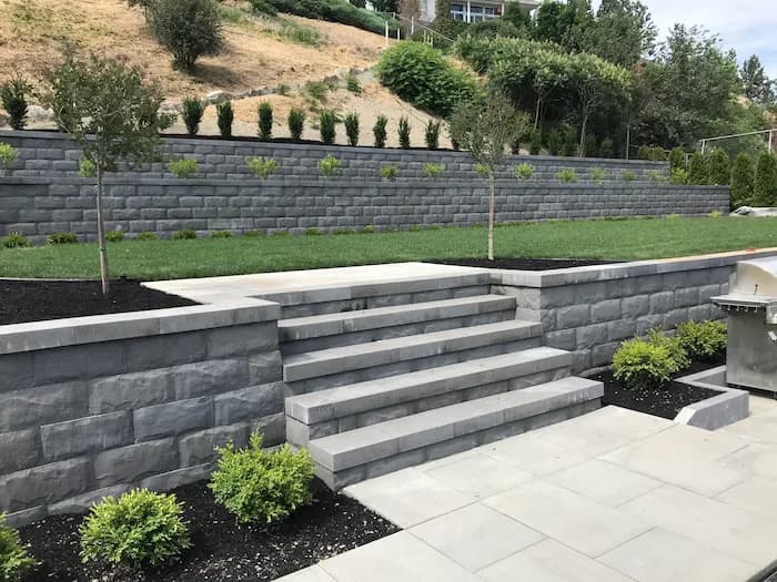 Retaining wall and stairs by Empire Landscaping.