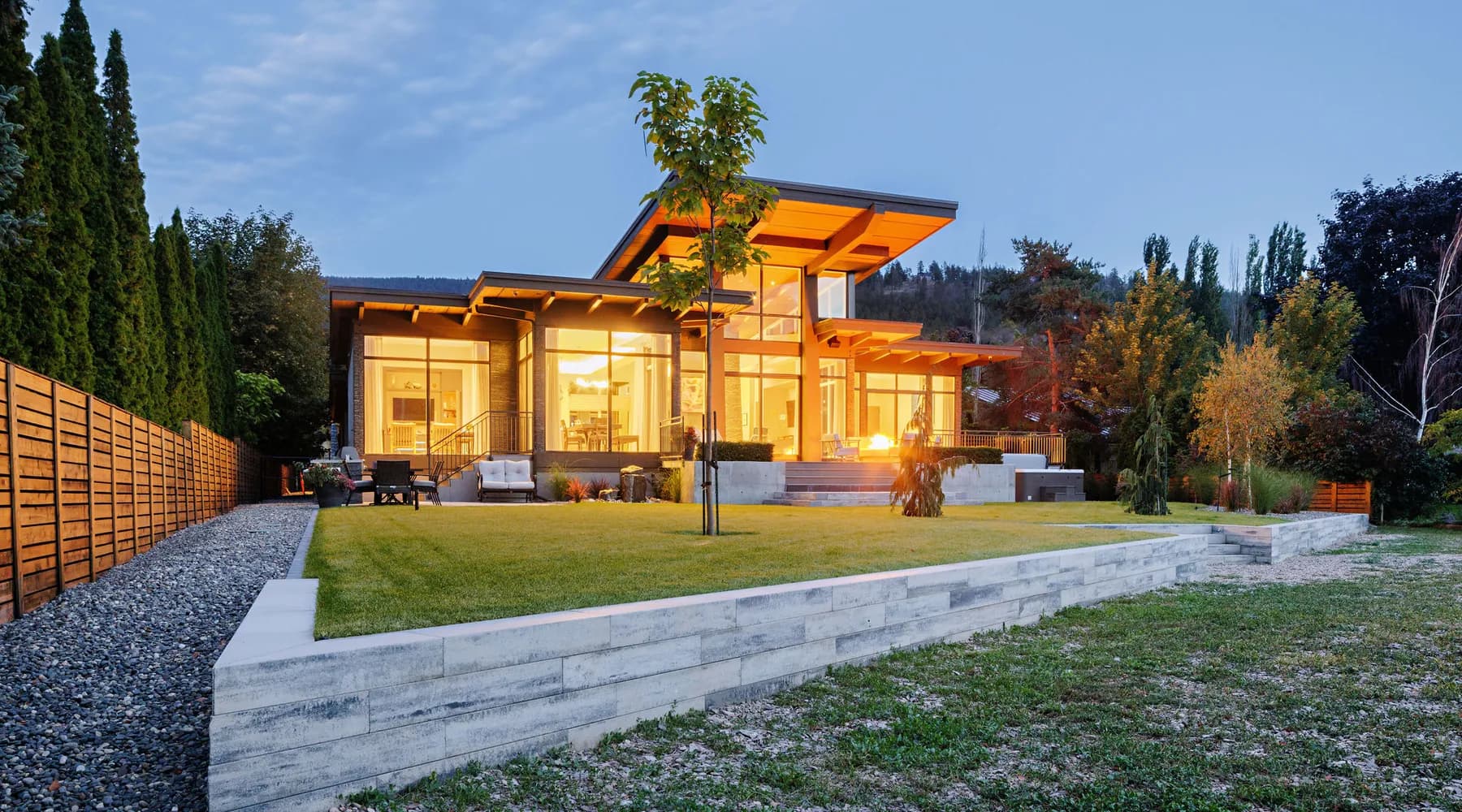 modern home retaining walls and grass with tree