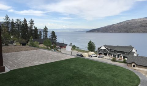turf installation in a backyard with a view of Kelowna